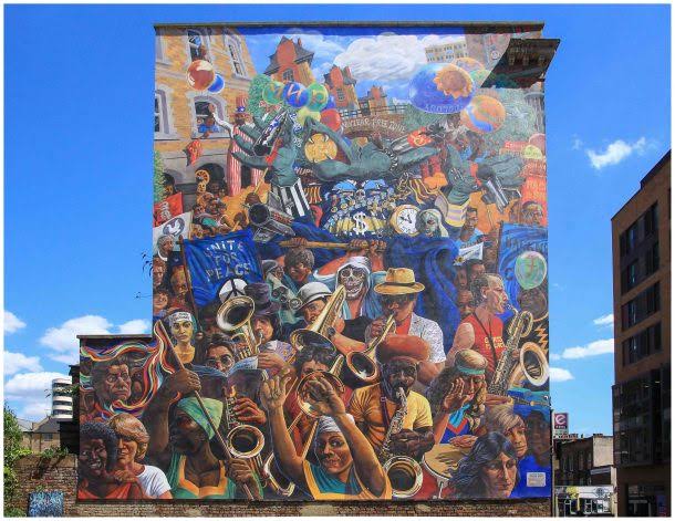 An photo of The Hackney Peace Carnival Mural on Dalston Lane
